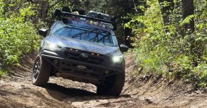 ReTrekin New England Subaru on a wooded off-road trail